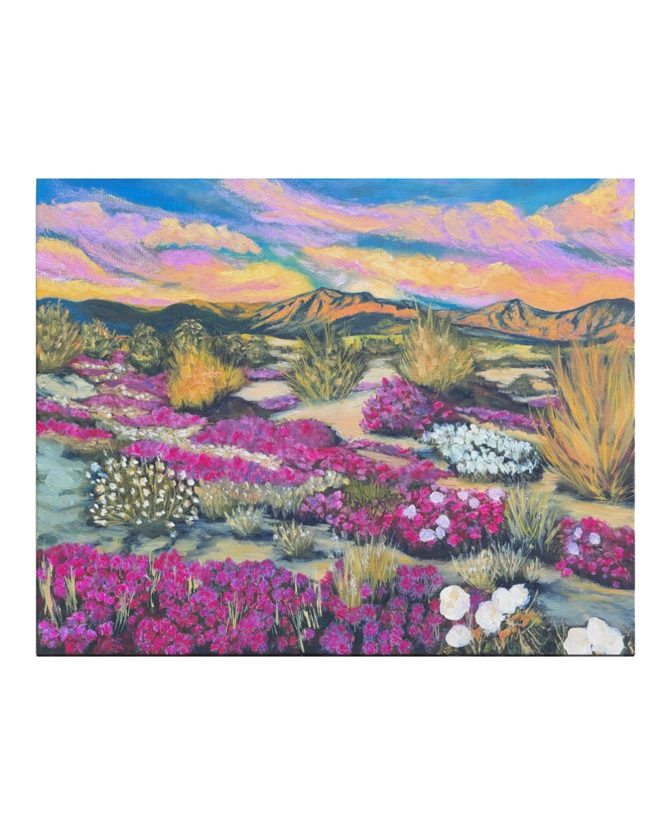 Desert landscape with colorful flowers and mountains in the background