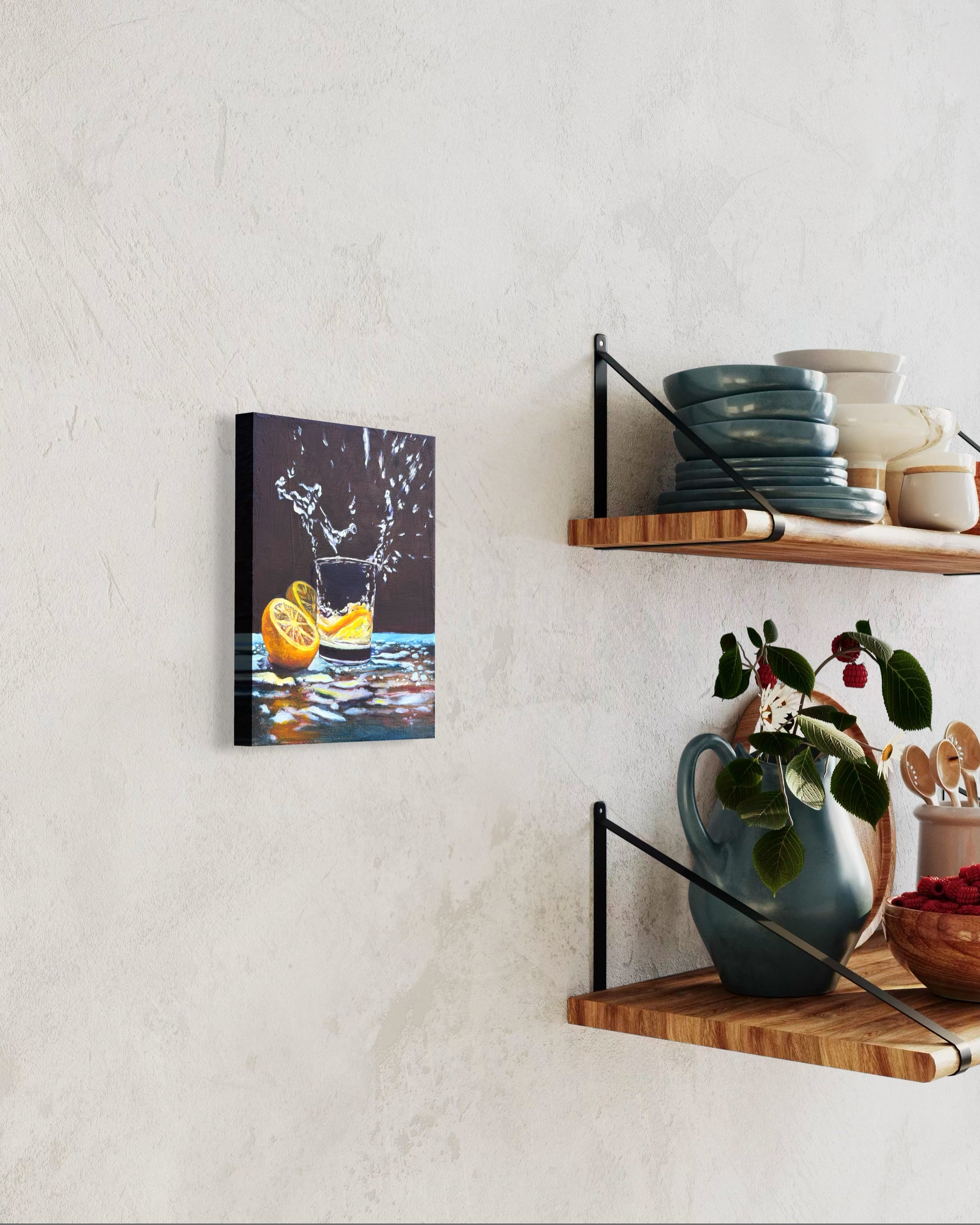 Canvas oil painting of a glass of water with lemon slices dropped in the water creating splashes on a wall. It's hanging on the wall next to wooden shelves with kitchen items.