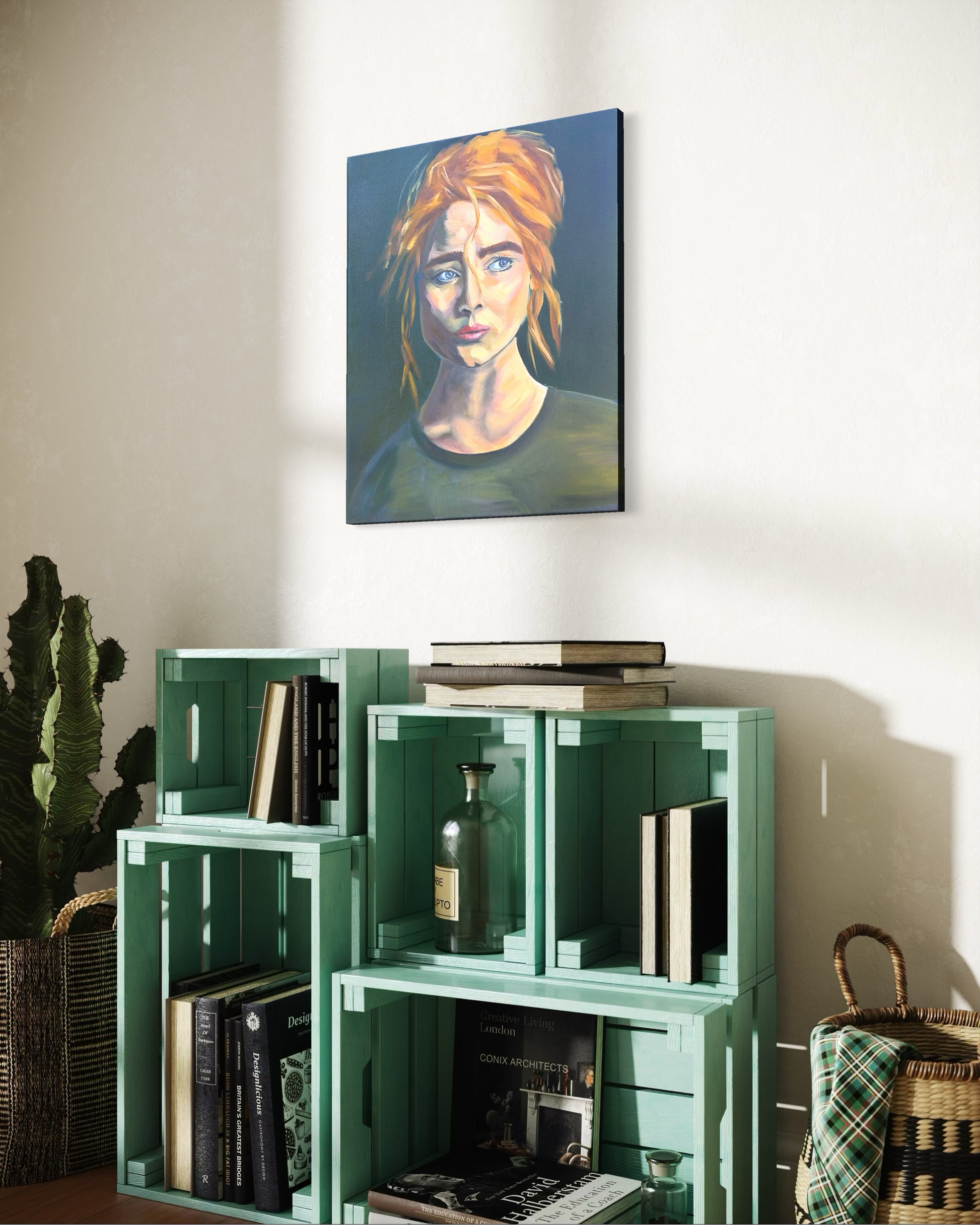 Green bookshelf with books and a bottle, wall art oil painting of a woman with red hair above it.